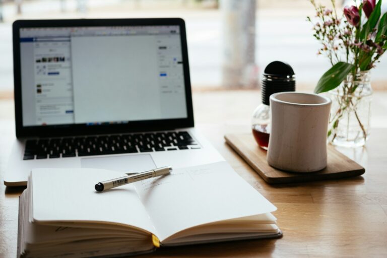 Notebook and laptop on a desk