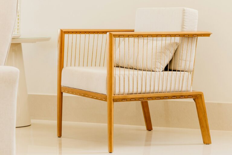 A wooden armchair with a light seat